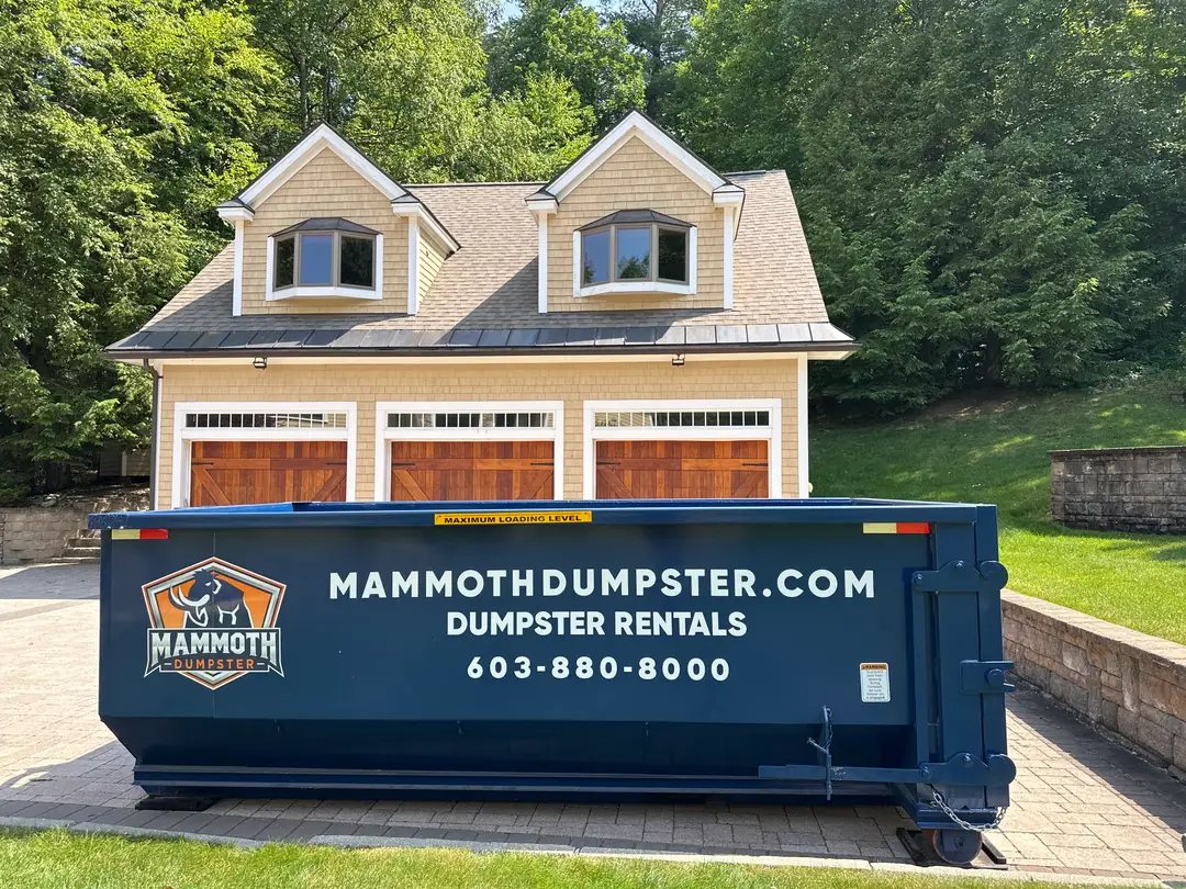 Mammoth roll off dumpster at a home renovation